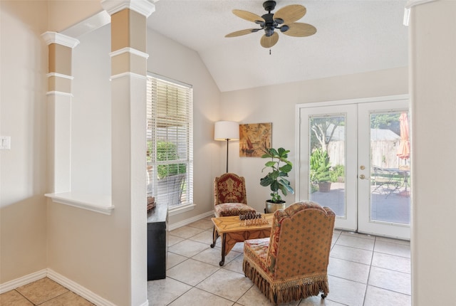 living area featuring french doors, ornate columns, a wealth of natural light, and lofted ceiling