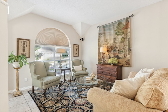 living room featuring light tile patterned floors, a textured ceiling, and vaulted ceiling