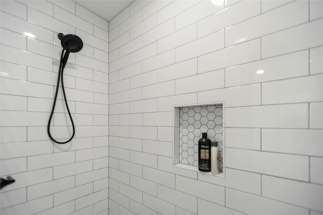 bathroom with a tile shower