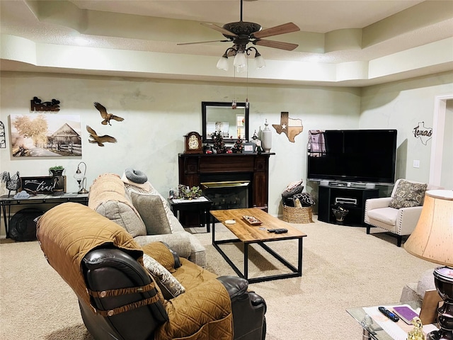 living room featuring ceiling fan and carpet flooring