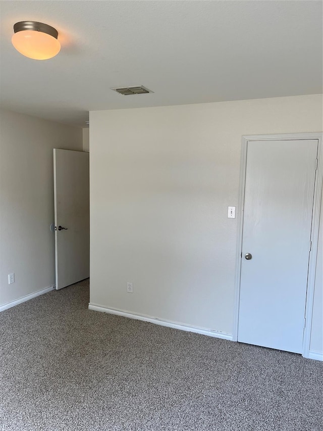 empty room featuring carpet flooring