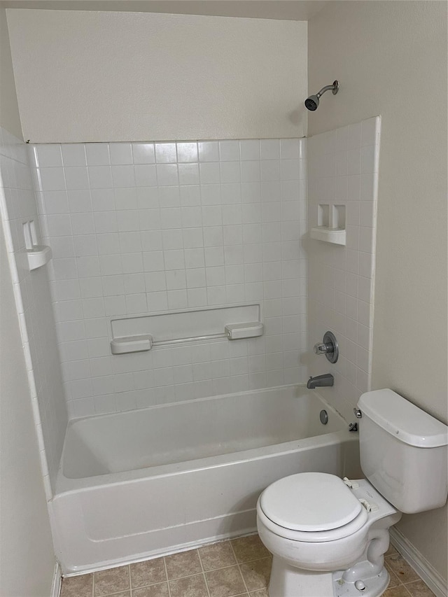 bathroom featuring tile patterned floors, shower / bath combination, and toilet