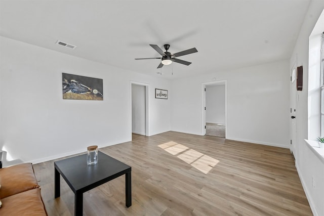 unfurnished living room with ceiling fan and light hardwood / wood-style flooring