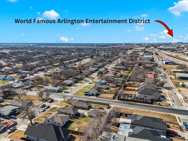 birds eye view of property with a residential view