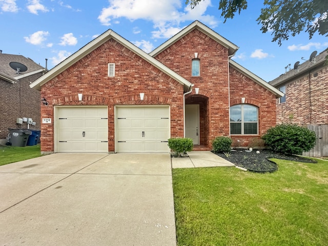 front of property featuring a garage and a front lawn