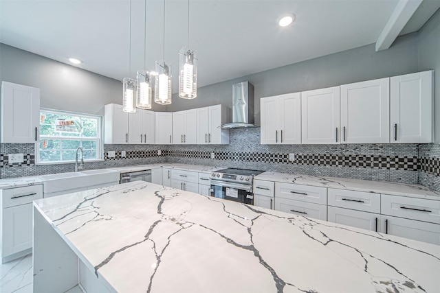 kitchen featuring light stone counters, appliances with stainless steel finishes, wall chimney exhaust hood, and white cabinets