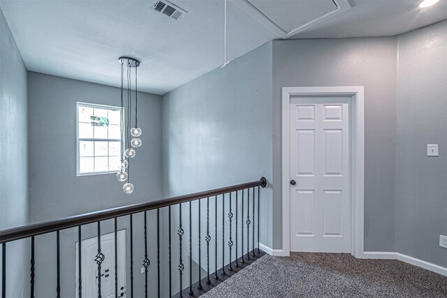 hallway featuring carpet