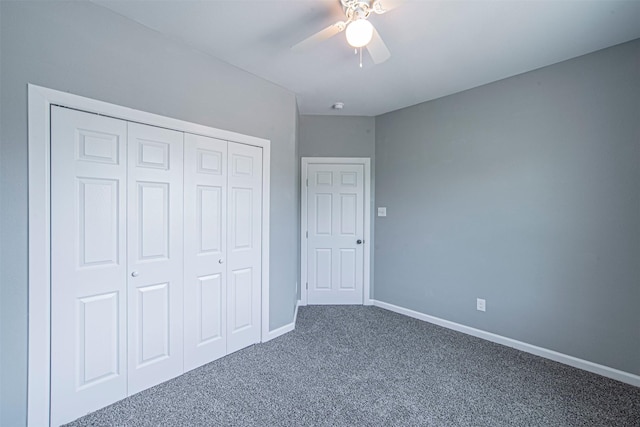 unfurnished bedroom featuring a closet, ceiling fan, and carpet flooring