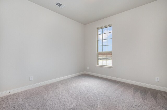 spare room with carpet floors