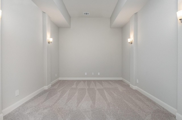 empty room featuring light carpet