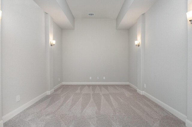 unfurnished room featuring light colored carpet