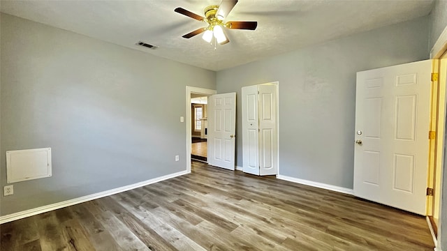 unfurnished bedroom with hardwood / wood-style flooring and ceiling fan