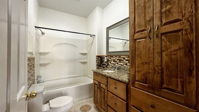 full bathroom featuring tub / shower combination, tile patterned floors, toilet, decorative backsplash, and vanity