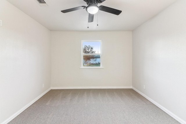 unfurnished room with carpet flooring and ceiling fan