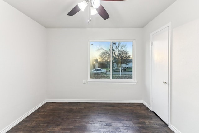 unfurnished room with dark hardwood / wood-style floors and ceiling fan