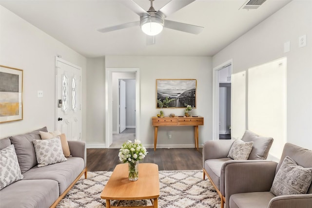 living room with dark hardwood / wood-style floors and ceiling fan