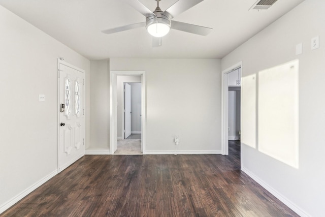 unfurnished room with dark hardwood / wood-style floors and ceiling fan