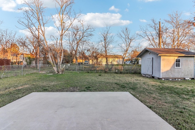 view of yard with a patio and a storage shed