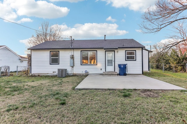 back of house featuring a patio, cooling unit, and a lawn