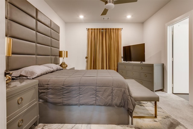 carpeted bedroom with ceiling fan