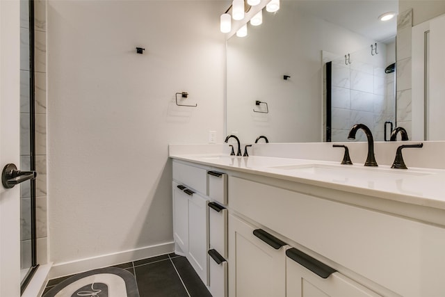 bathroom with tile patterned floors, vanity, and an enclosed shower