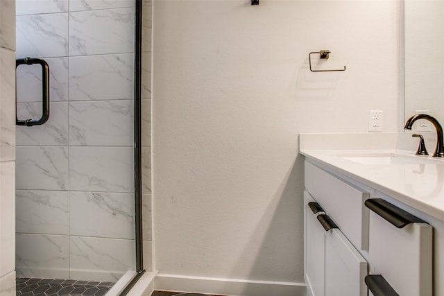 bathroom with sink and an enclosed shower