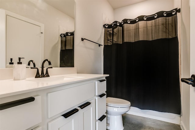 bathroom featuring vanity, toilet, and walk in shower