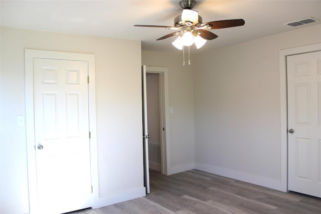 unfurnished bedroom featuring ceiling fan and light hardwood / wood-style flooring