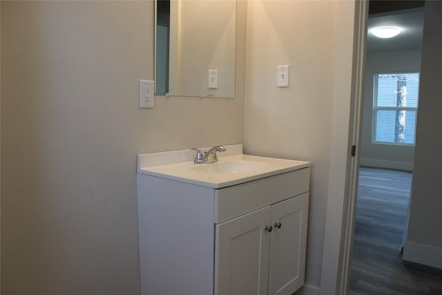 bathroom featuring hardwood / wood-style floors and vanity