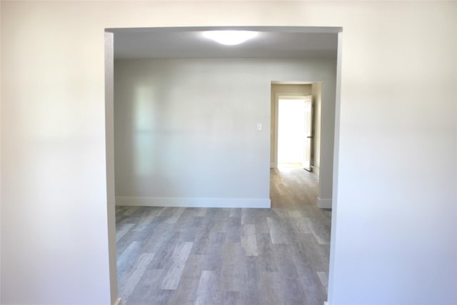 spare room featuring wood-type flooring