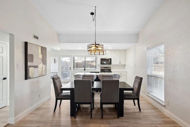 dining space featuring a notable chandelier and plenty of natural light