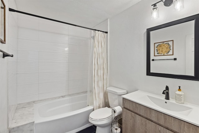 full bathroom featuring vanity, toilet, a textured ceiling, and shower / tub combo