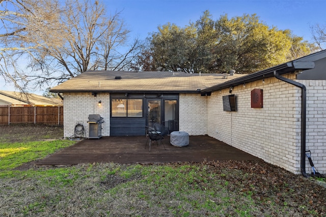 rear view of property with a deck