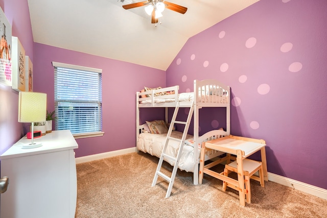 carpeted bedroom featuring ceiling fan and vaulted ceiling