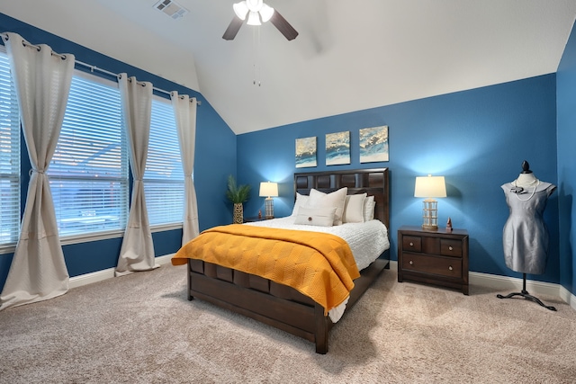 carpeted bedroom with ceiling fan and lofted ceiling