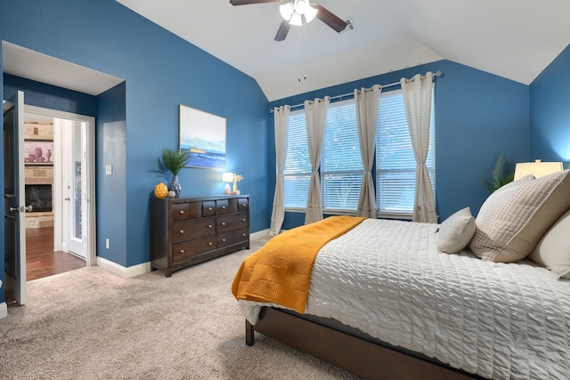 bedroom with carpet floors, ceiling fan, and lofted ceiling