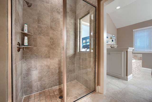 bathroom with lofted ceiling and a shower with shower door