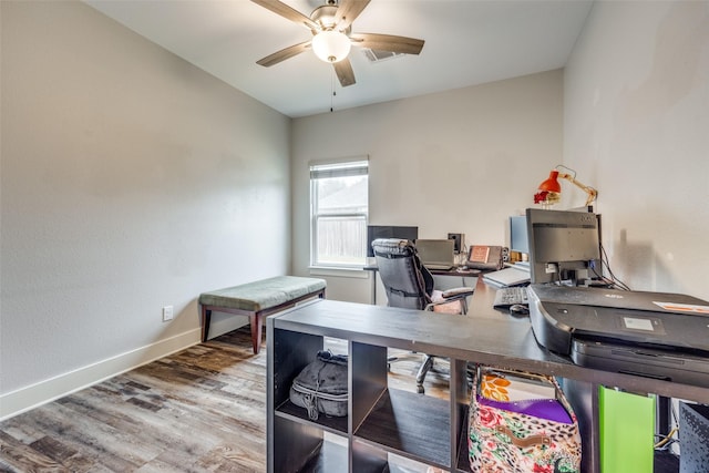 office space featuring wood-type flooring and ceiling fan