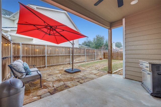 view of patio / terrace featuring ceiling fan