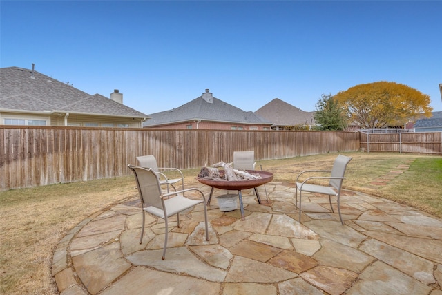 view of patio / terrace featuring a fire pit