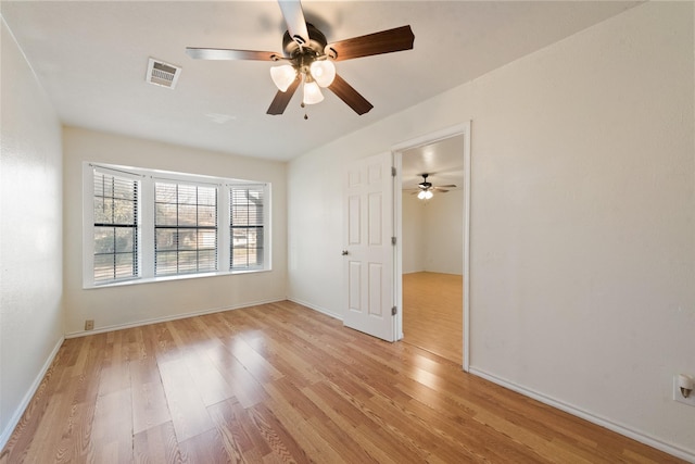 unfurnished room with ceiling fan and light hardwood / wood-style flooring