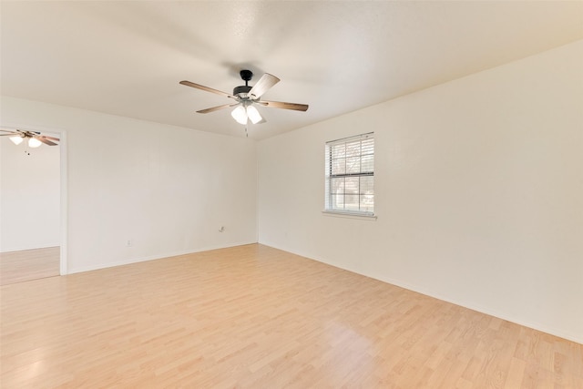 spare room featuring ceiling fan and light hardwood / wood-style floors