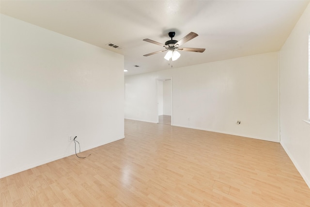 empty room with light hardwood / wood-style floors and ceiling fan