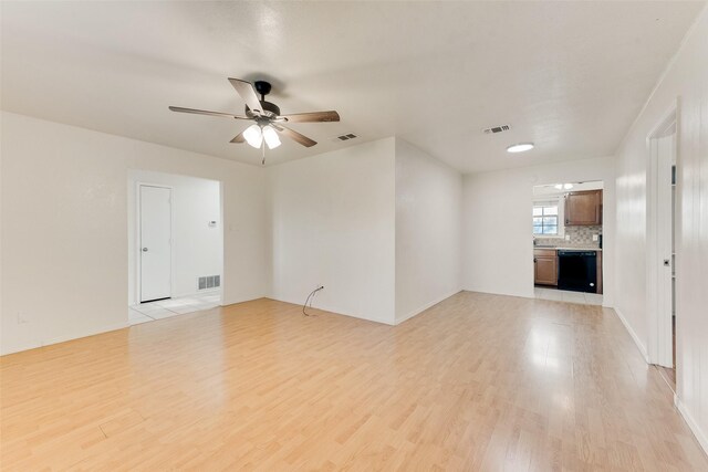 unfurnished living room featuring ceiling fan and light hardwood / wood-style floors