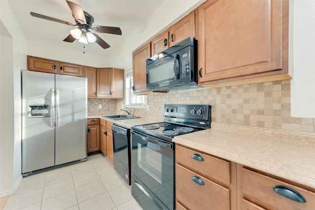 kitchen featuring black appliances, sink, ceiling fan, light tile patterned floors, and tasteful backsplash