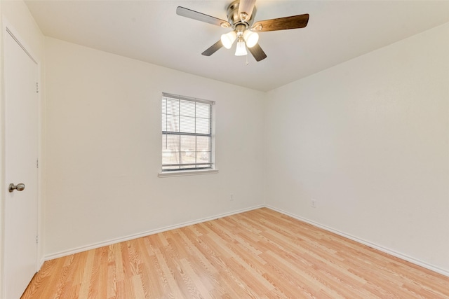 spare room with ceiling fan and light hardwood / wood-style flooring