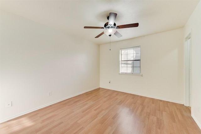 empty room with ceiling fan and light wood-type flooring