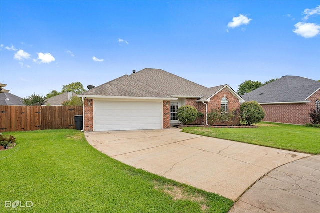 ranch-style home with a garage and a front yard