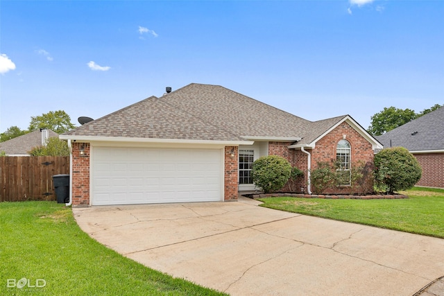 ranch-style home with a garage and a front yard