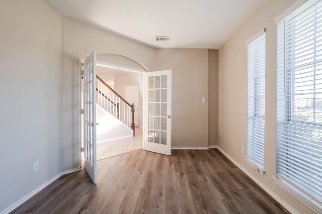 interior space featuring french doors and hardwood / wood-style flooring